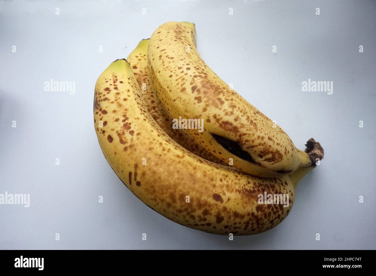 Ripe bananas with brown spots on their skin Stock Photo