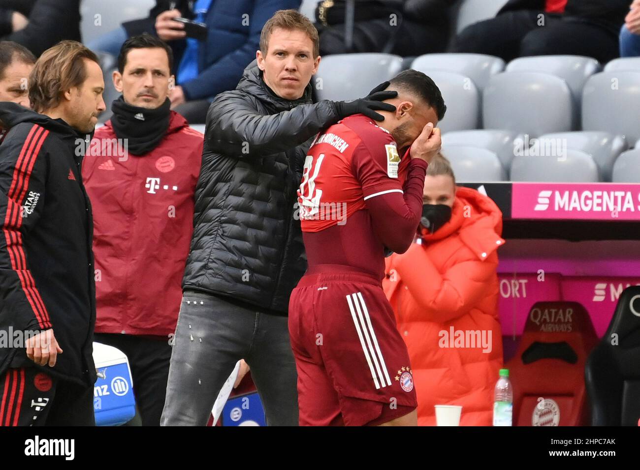 Corentin TOLISSO (FC Bayern Munich) with coach Julian NAGELSMANN (FC Bayern Munich). injured, injury. Soccer 1st Bundesliga season 2021/2022, 23.matchday, matchday23. FC Bayern Munich - Greuther Furth, on February 20th, 2022, ALLIANZARENA Munich. Stock Photo