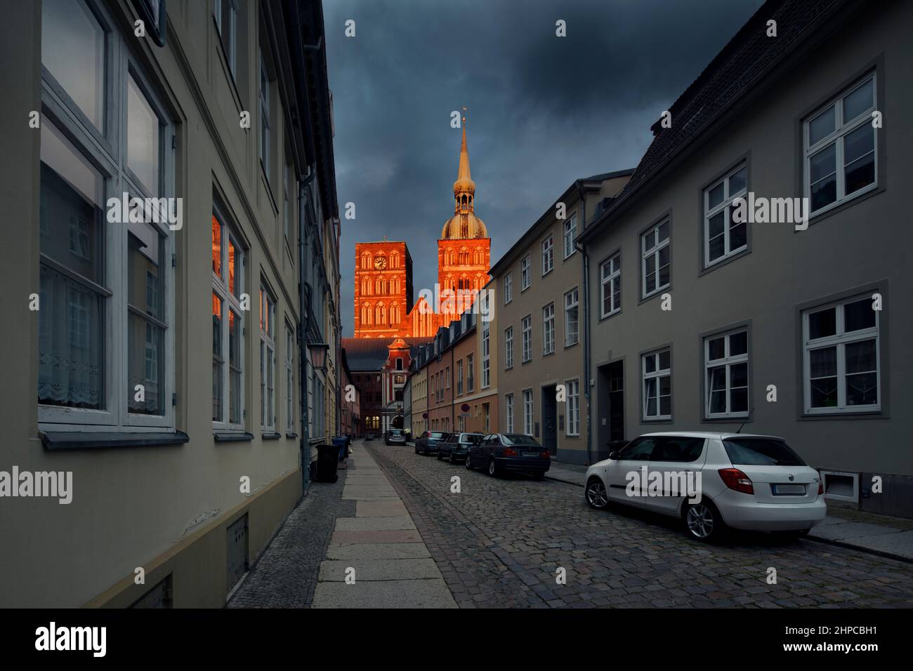 Stralsund Ravensberger Street and The two Gothic bell towers of the St. Nicholas Church Stock Photo