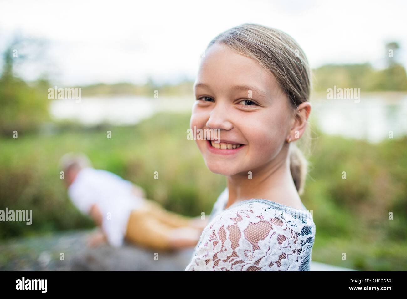 Portrait of smiling young vibrant woman. Stock Photo