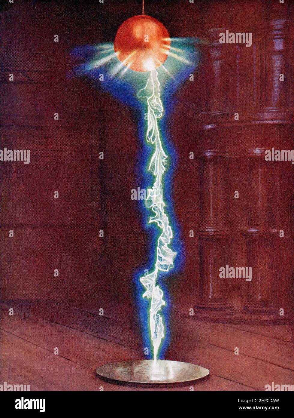 Lightning in a laboratory storm.  A million volt flash passing from a large copper ball suspended from an insulator to an earth consisting of a metal plate twelve feet below.  From The Wonder Book of Science, published 1930's. Stock Photo