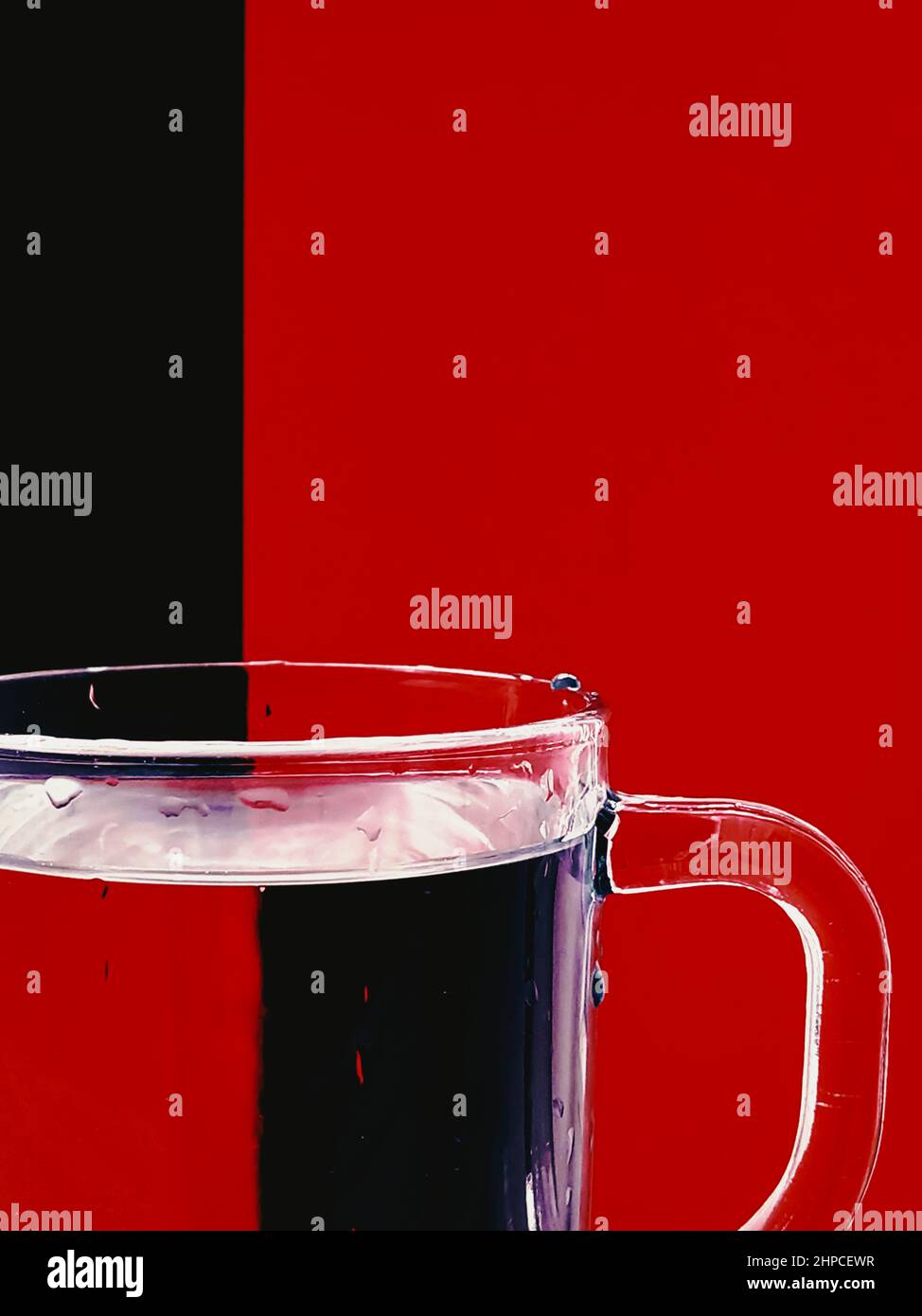 cup of water. red and black visual illusion Stock Photo