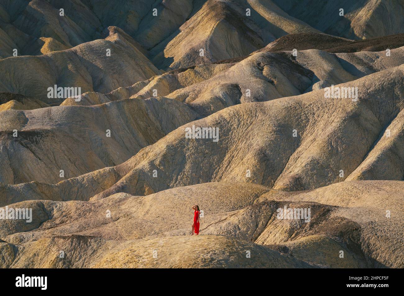 Female posing at Zabriskie Point in Death Valley National Park Stock Photo