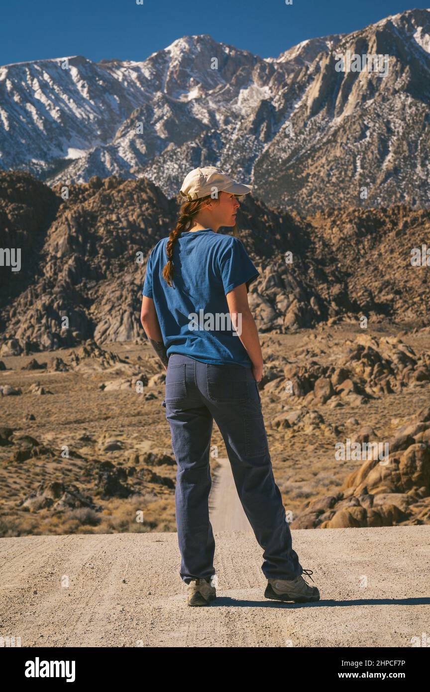 Female posing on Movie Road in The Alabama Hills Stock Photo
