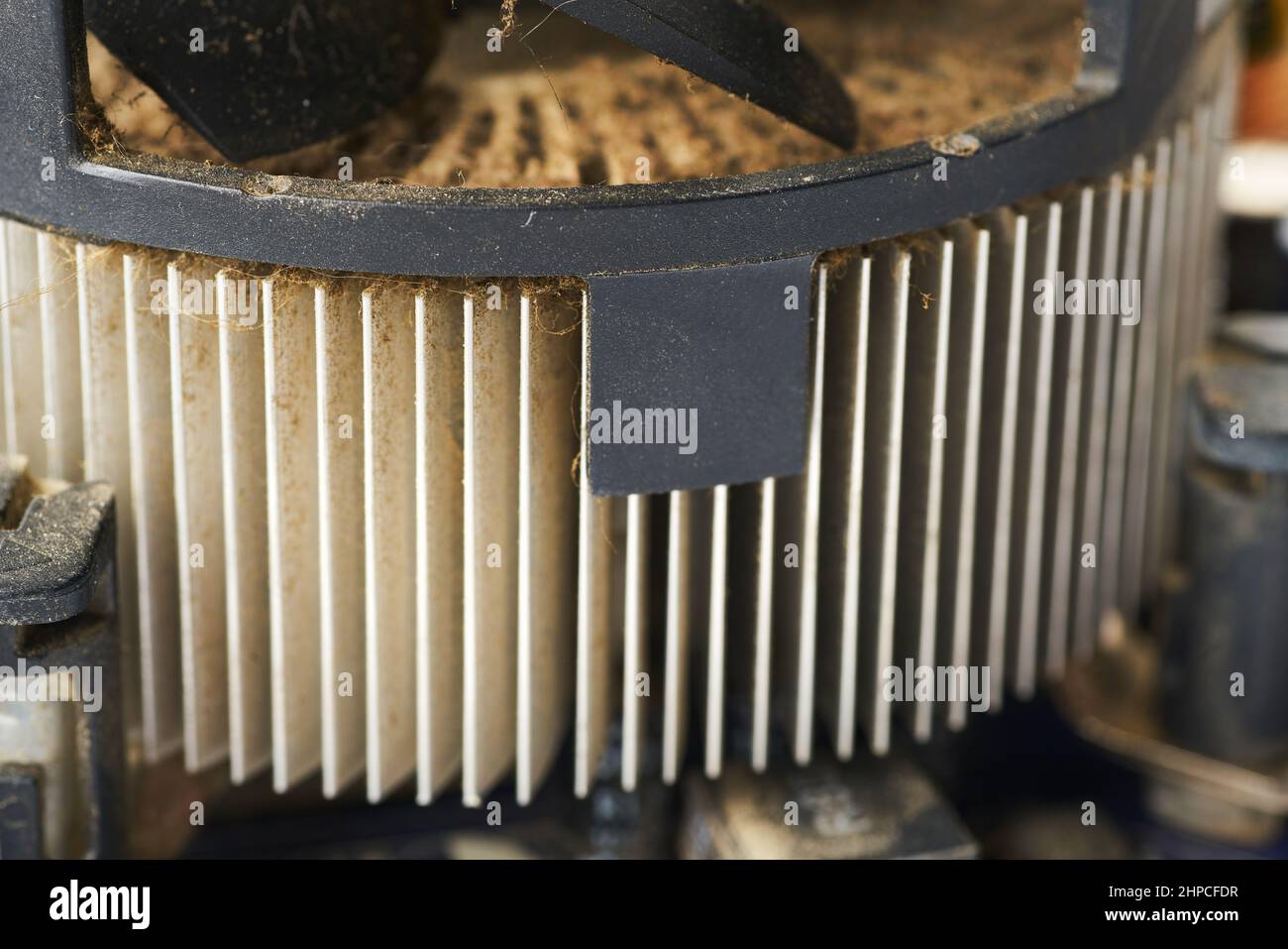 Old computer system unit with spider web and dust inside. Stock Photo