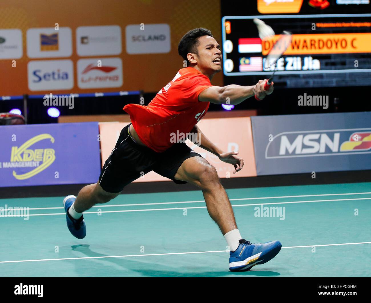 Kuala Lumpur, Malaysia. 20th Feb, 2022. Dwi Wardoyo Chico Aura of Indonesia  plays against Lee Zii Jia of Malaysia during the final of the team men's  singles match at the Badminton Asia