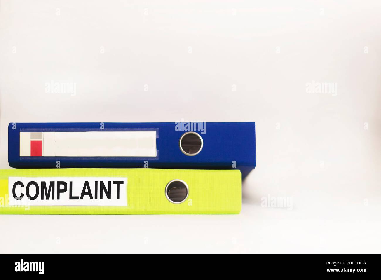 complaint-words-on-a-label-with-a-folder-for-documents-on-a-white