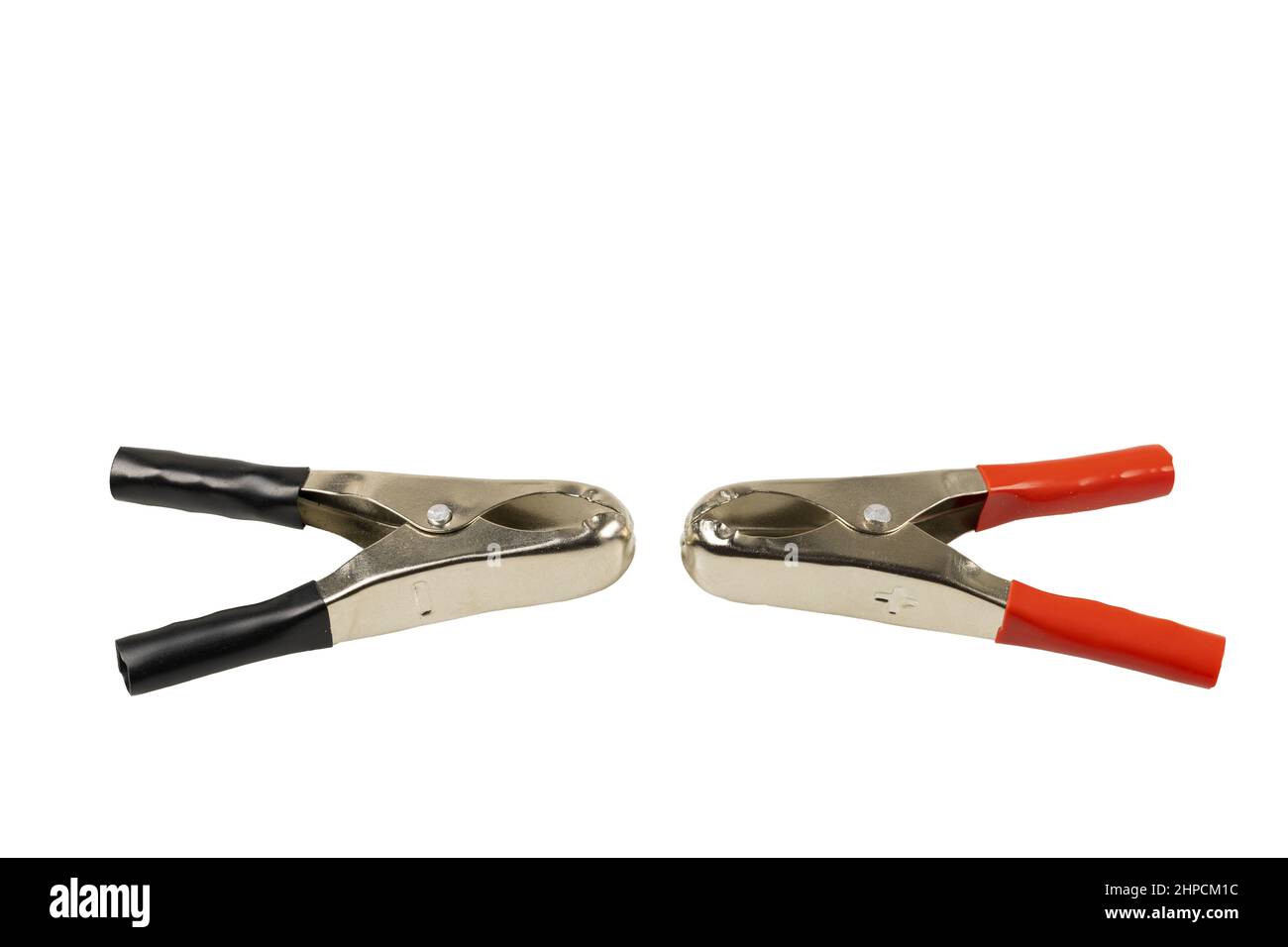 Close up view of two clips for charging battery isolated on white