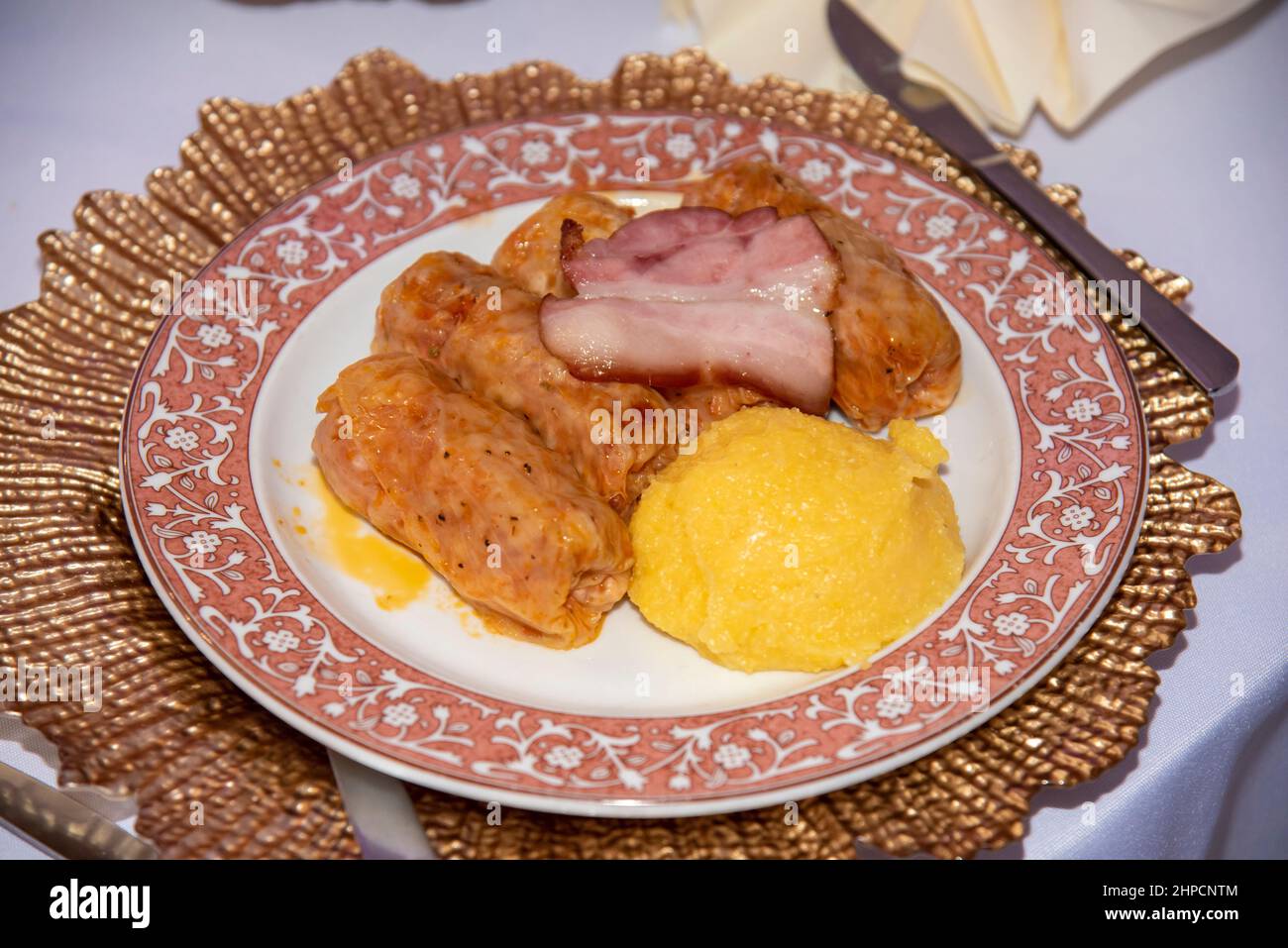 traditional dish of sarmale with polenta on plate with brown edges Stock Photo