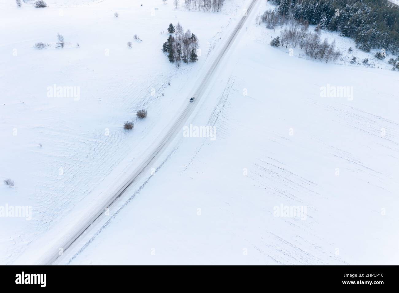 Broken Car in the Middle of Nowhere During Winter Season Stock Photo