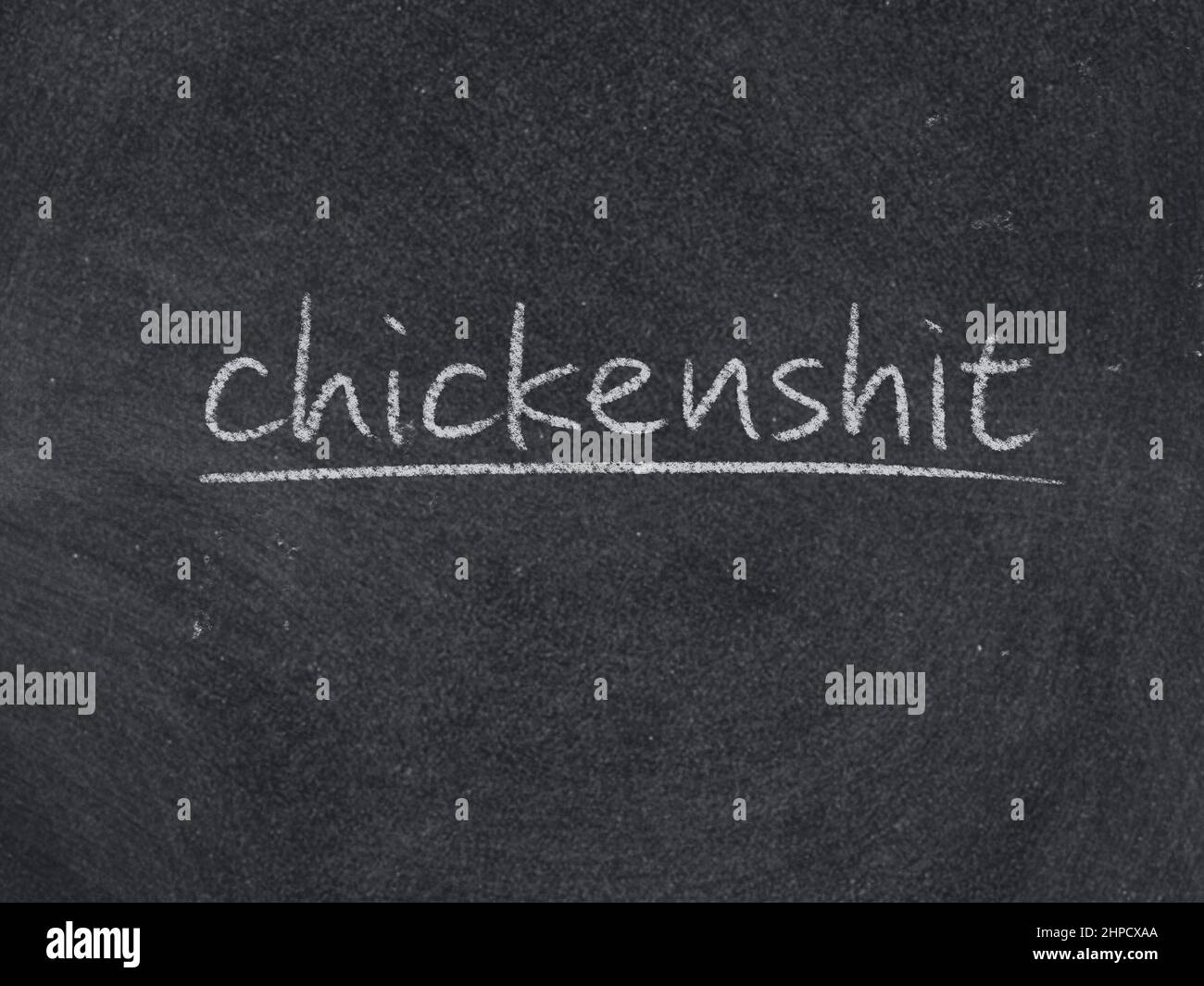 chickenshit concept word on blackboard background Stock Photo