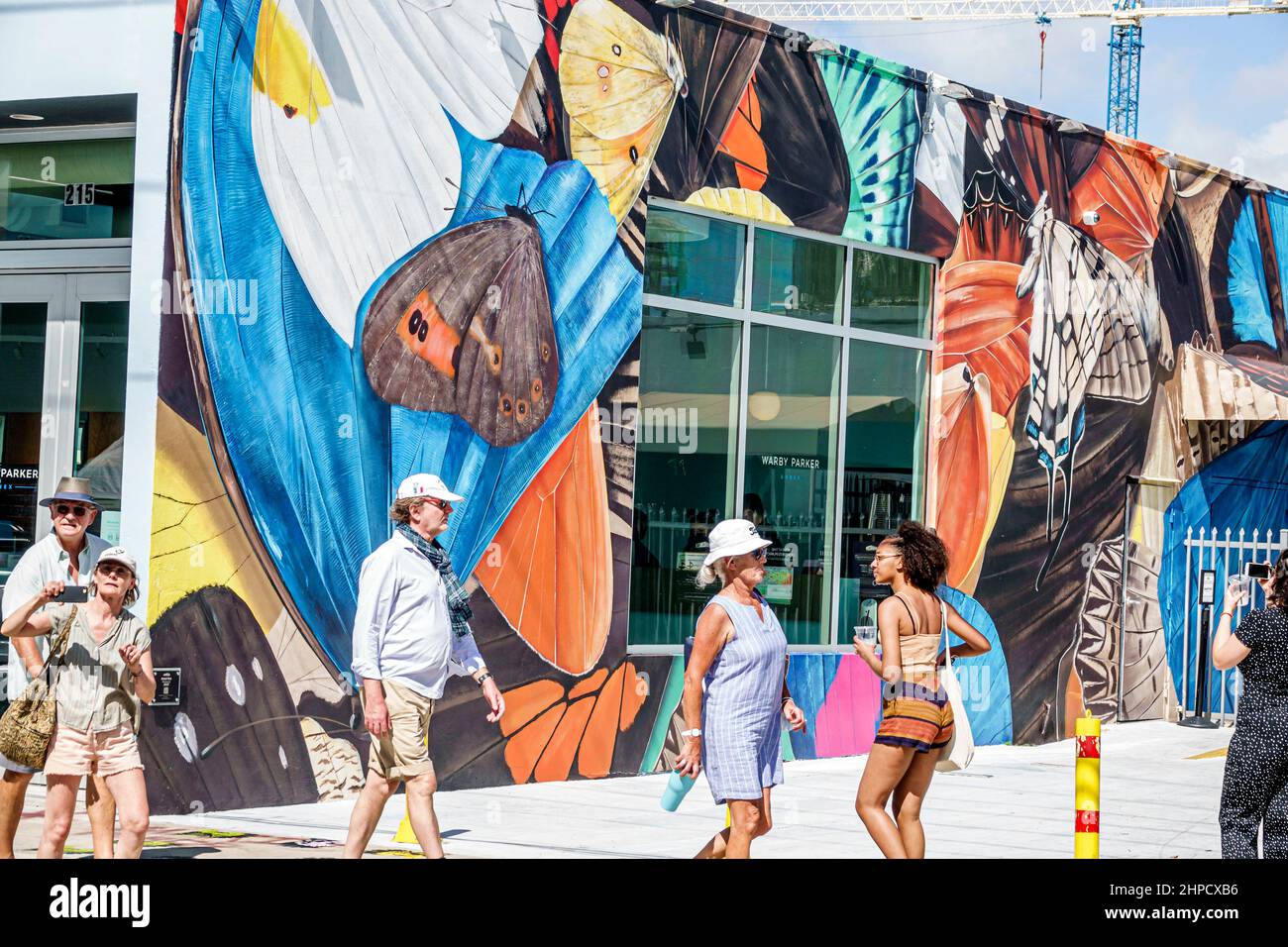 Miami Florida Wynwood Art District wall artwork visitors pedestrians Stock Photo