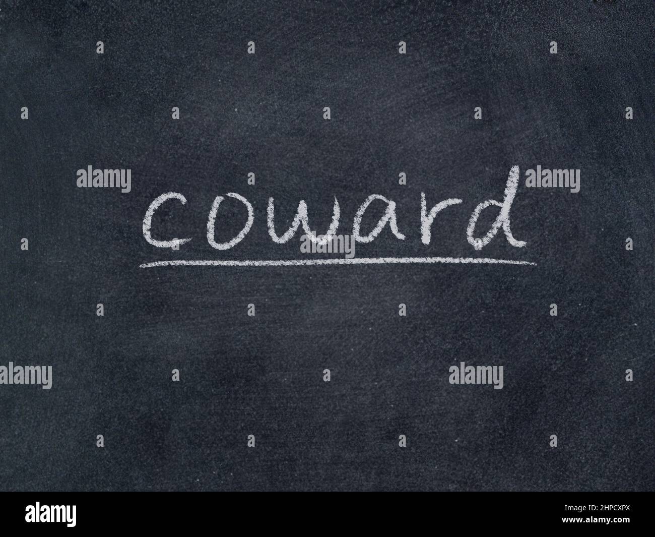 coward concept word on blackboard background Stock Photo