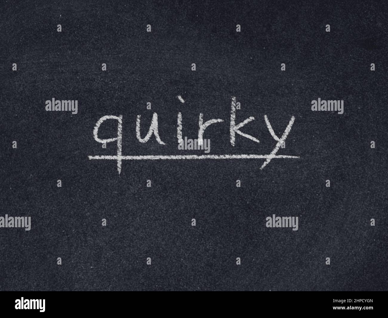 quirky concept word on blackboard background Stock Photo