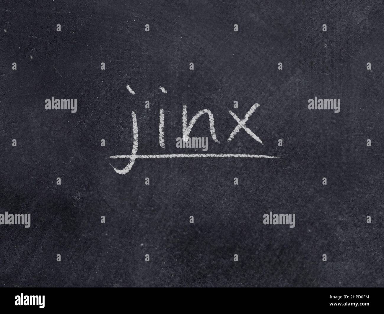 jinx concept word on blackboard background Stock Photo