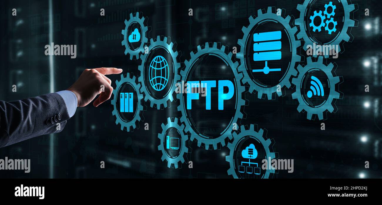 Businessman Hand touching FTP inscription. Mixed Media Technology concept. Stock Photo