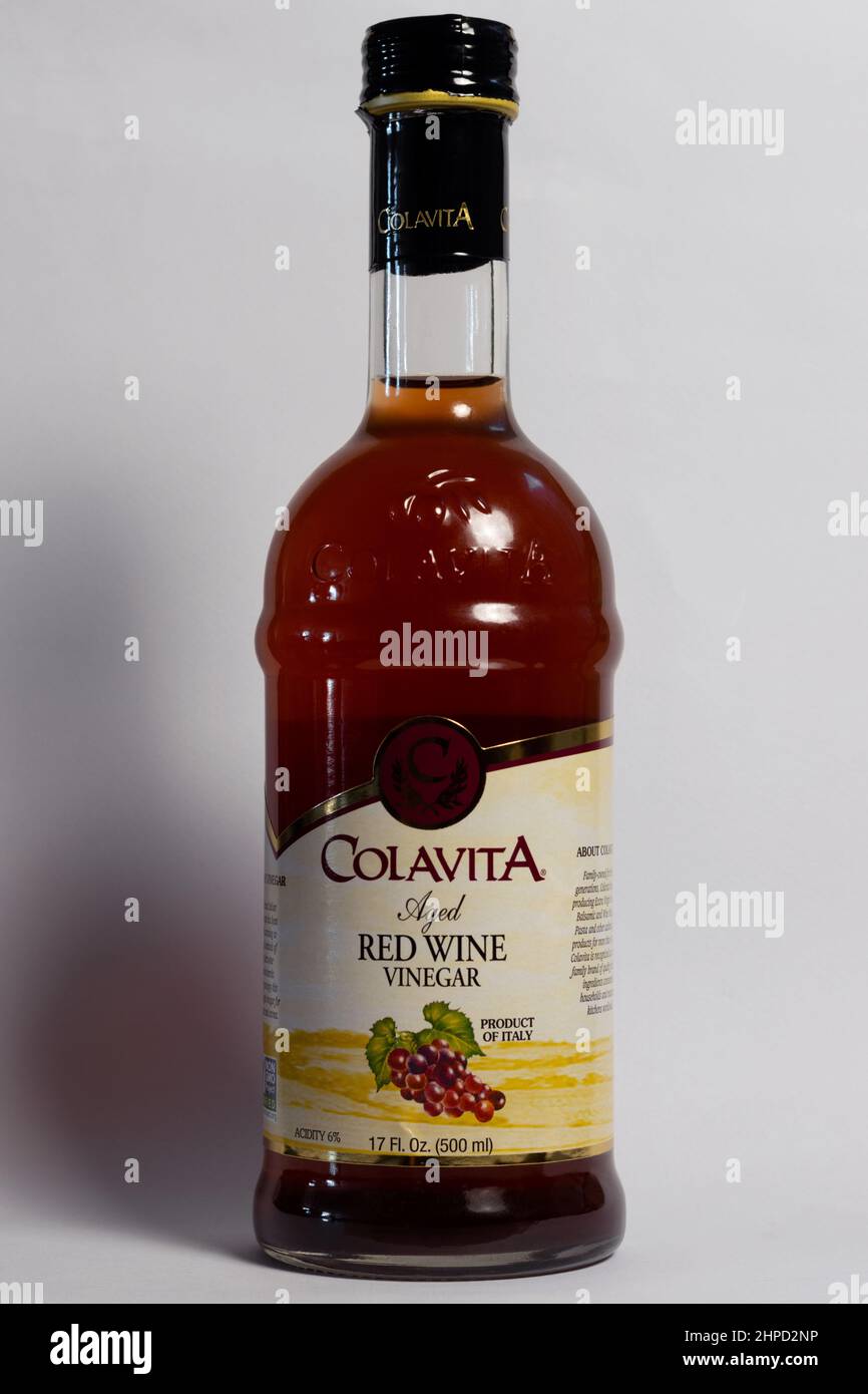 bottle of Colavita aged red wine vinegar on a neutral background, a product of Italy Stock Photo