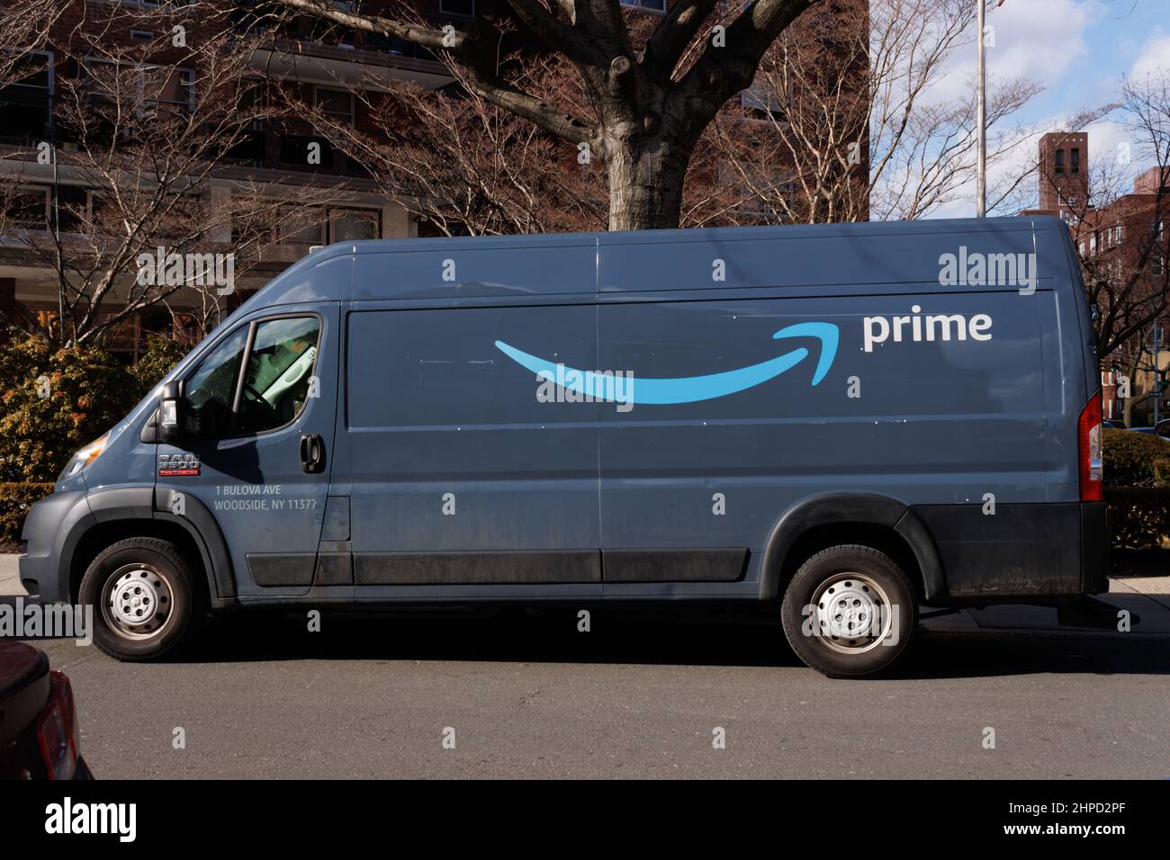 Amazon prime delivery van or truck parked on a street in Queens, New York Stock Photo