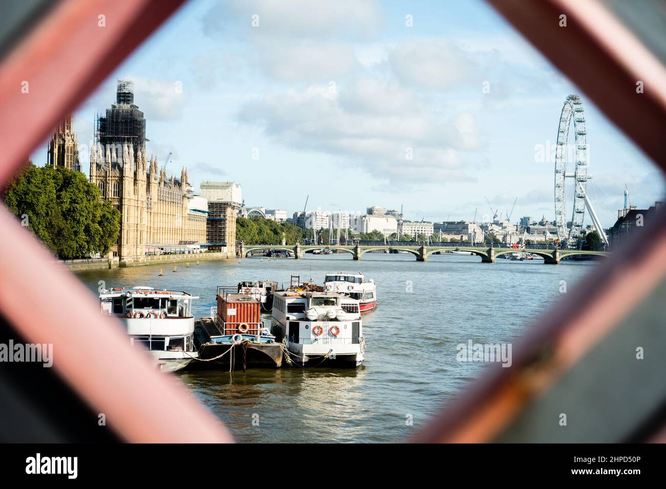 View of the Thames river, Big Ben in works and London Eye in London Stock Photo