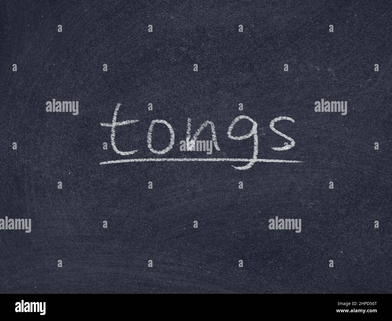 tongs concept word on blackboard background Stock Photo