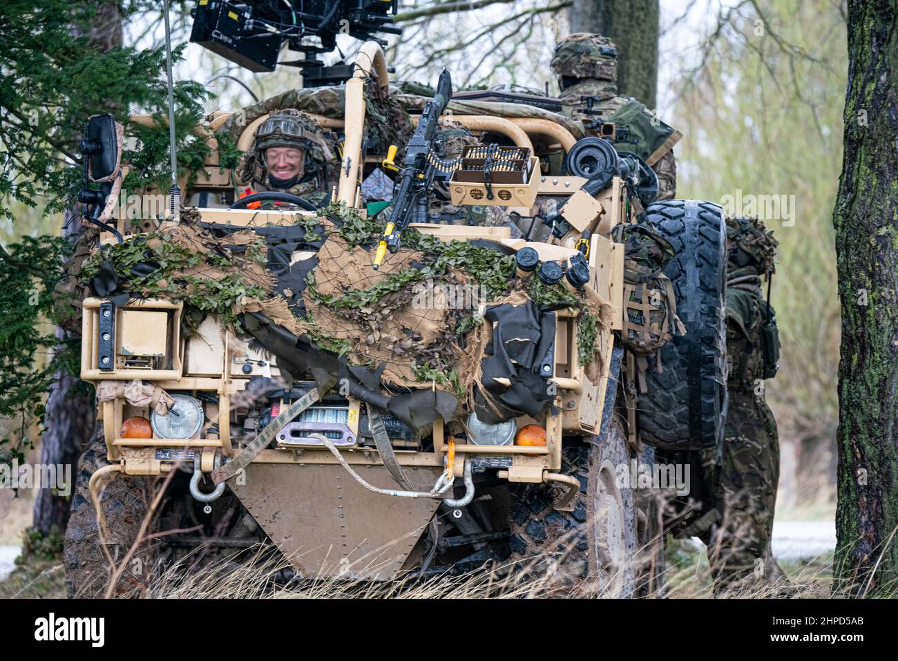 British army Supacat Jackal 4x4 rapid assault, fire support and reconnaissance vehicles on a military battle training exercise, Wiltshire UK Stock Photo