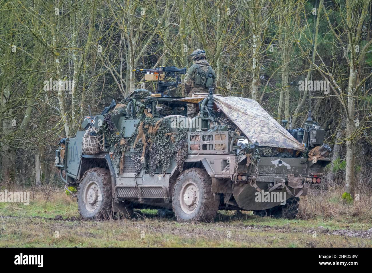 British army Supacat Jackal 4x4 rapid assault, fire support and reconnaissance vehicles on a military battle training exercise, Wiltshire UK Stock Photo