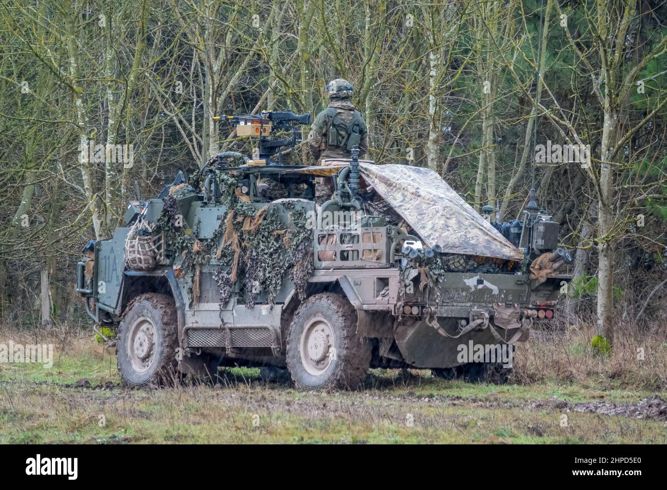 British army Supacat Jackal 4x4 rapid assault, fire support and reconnaissance vehicles on a military battle training exercise, Wiltshire UK Stock Photo