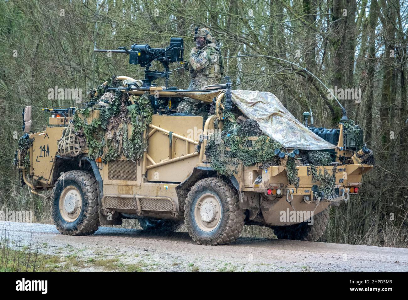 British army Supacat Jackal 4x4 rapid assault, fire support and reconnaissance vehicles on a military battle training exercise, Wiltshire UK Stock Photo