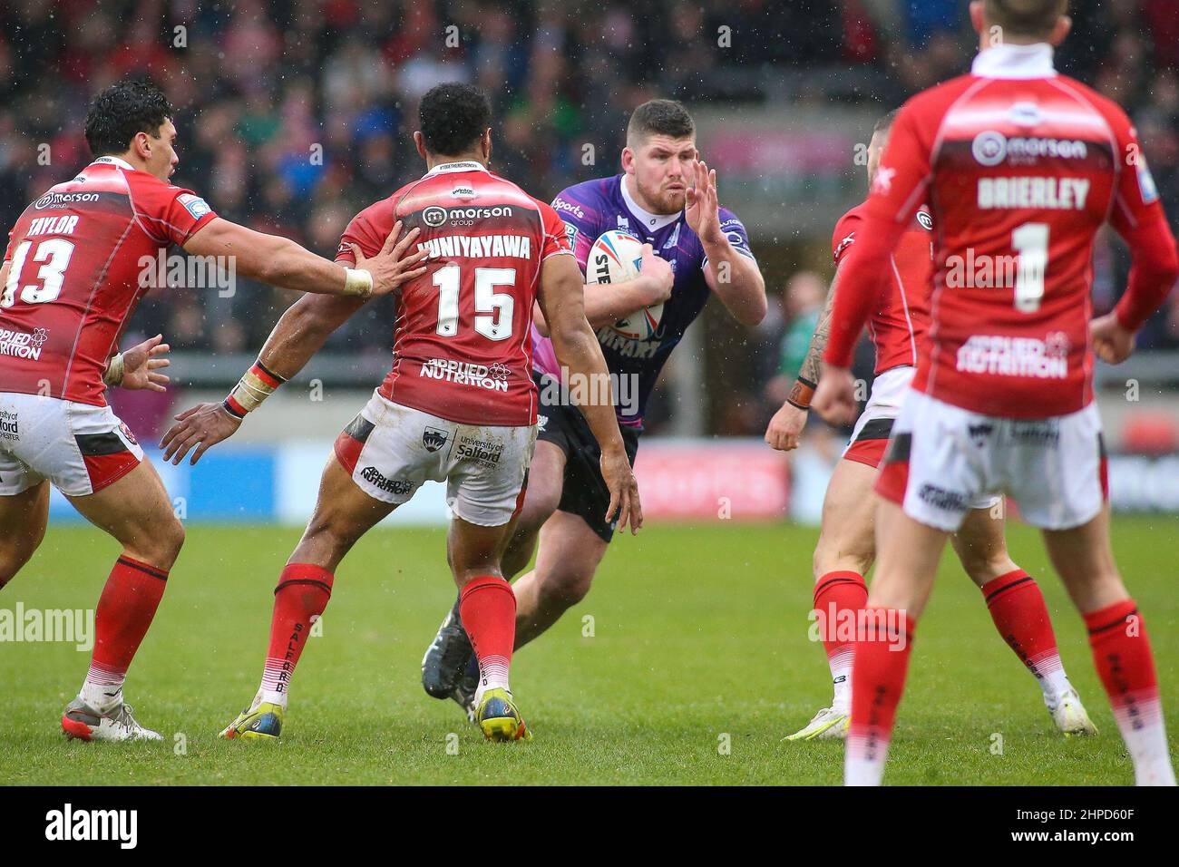 Salford, UK, 20 February 2022. Mitch Garbutt of Toulouse burst through the Salford defence during the Super League match between Salford Red Devils and Toulouse at The AJ Bell Stadium, Salford on 20 February 2022. Photo by Simon Hall. Editorial use only, license required for commercial use. No use in betting, games or a single club/league/player publications. Credit: UK Sports Pics Ltd/Alamy Live News Stock Photo