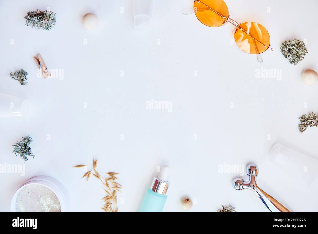 Trendy face care cosmetics background. Serum, patches, massager and