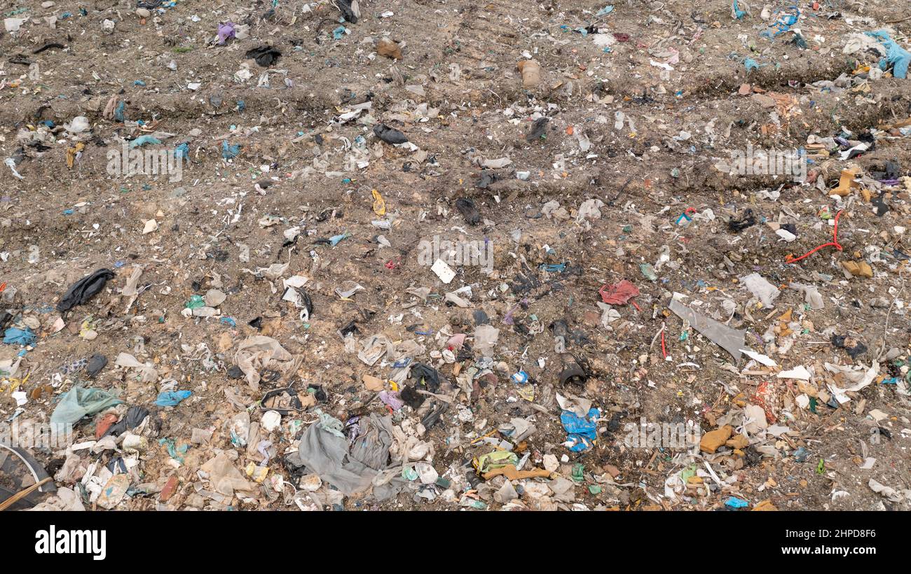 Stack of different types of large garbage dump, plastic bags, and trash