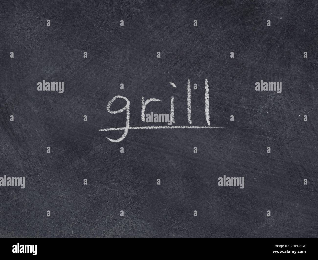 grill concept word on blackboard background Stock Photo