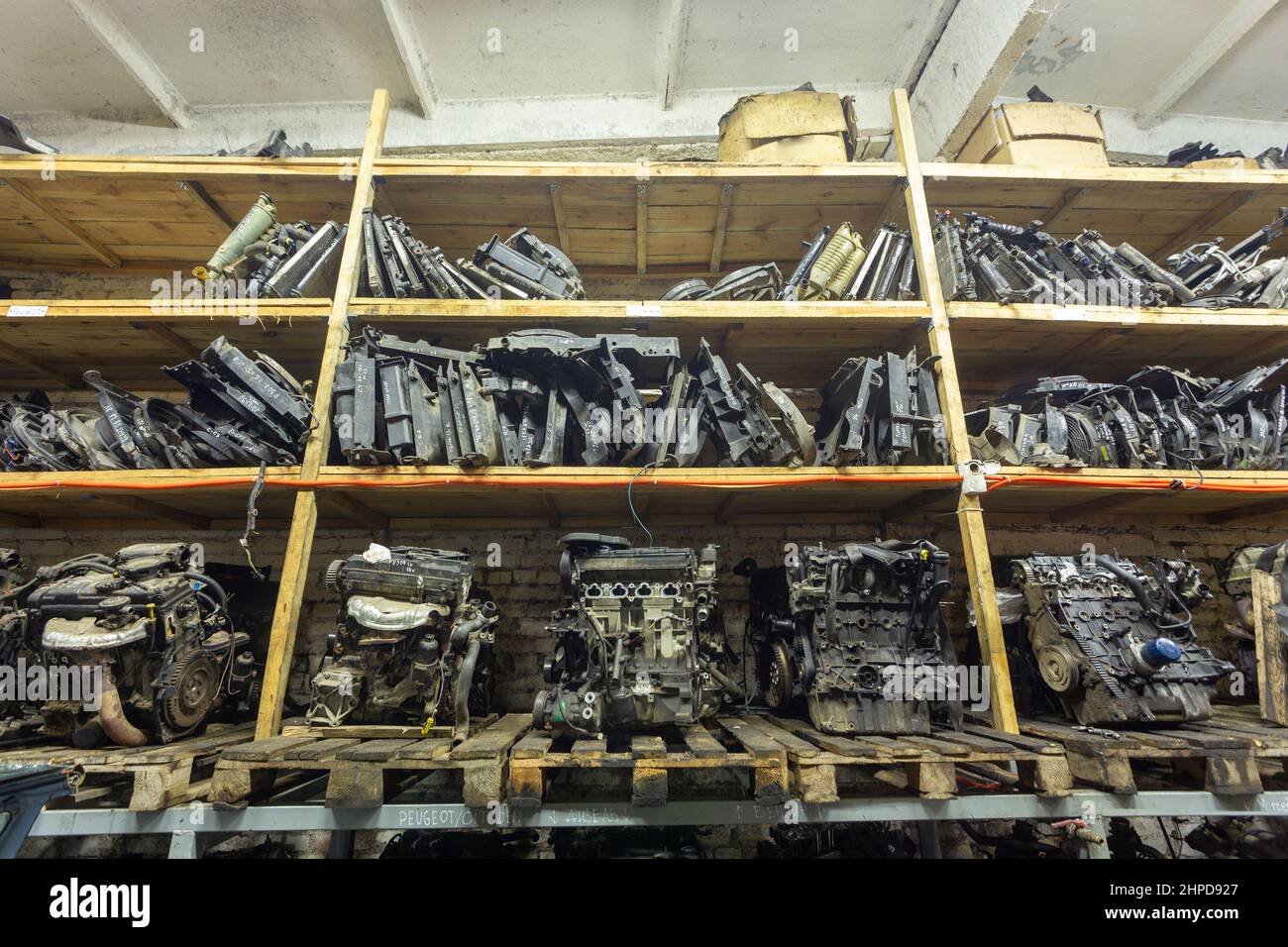 Warehouse with used auto parts for sale. Radiators of the cooling system and engines on the