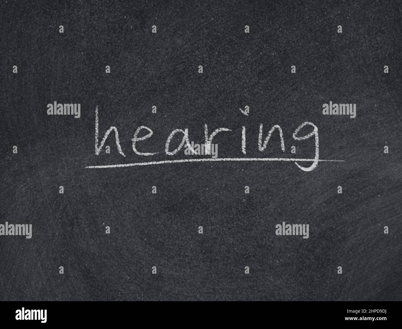 hearing concept word on blackboard background Stock Photo