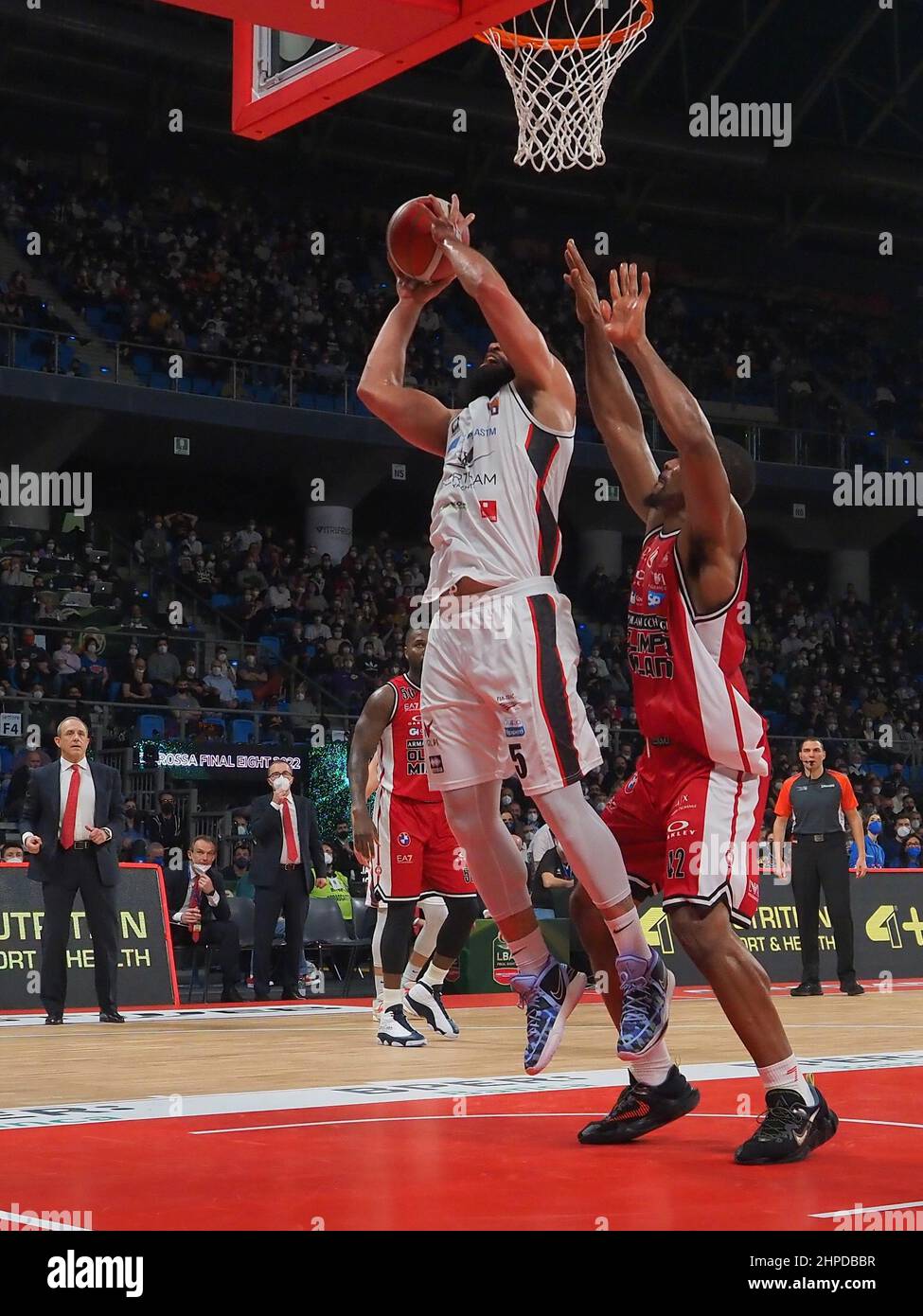 Pesaro, Italy. 20th Feb, 2022. Jalen Cannon (Bertram Derthona Basket) Mike  Daum (Bertram Derthona Basket) thwarted by Nicolo Melli (AX Armani Exchange  Olimpia Milano) during Final Eight - Final - AX Armani