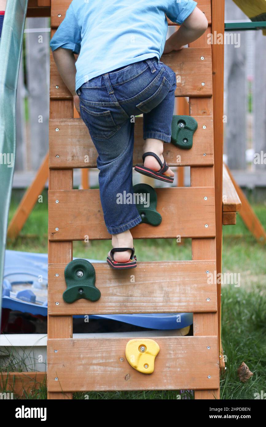 boy climbing at the playground Stock Photo