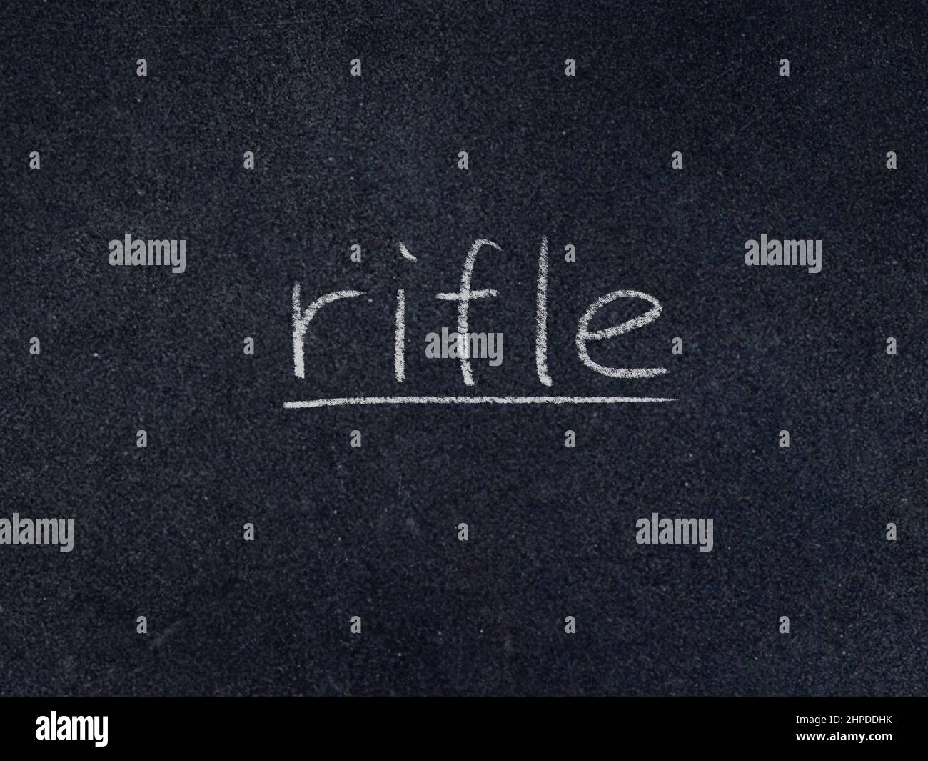 rifle concept word on blackboard background Stock Photo