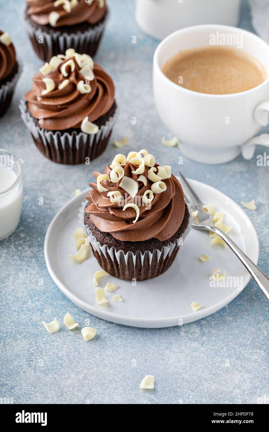 Dark chocolate cupcakes with whipped ganache frosting and white