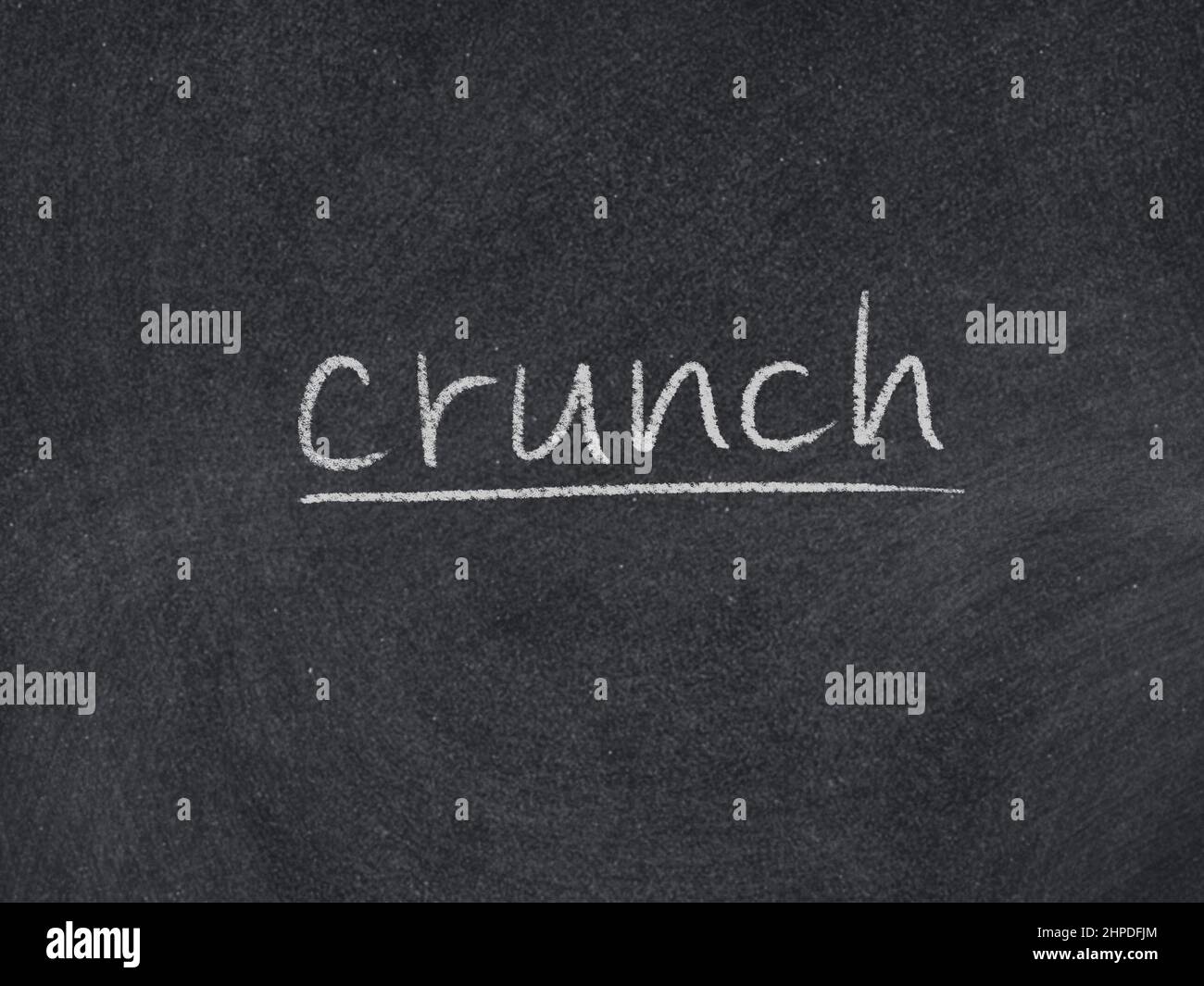 crunch concept word on blackboard background Stock Photo