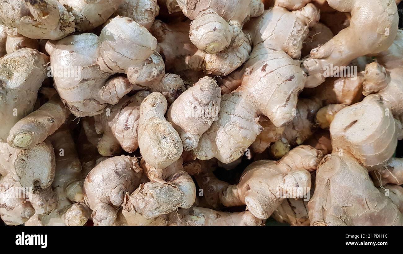 A large amount of ginger is placed for sale on the shelves in department stores. Stock Photo