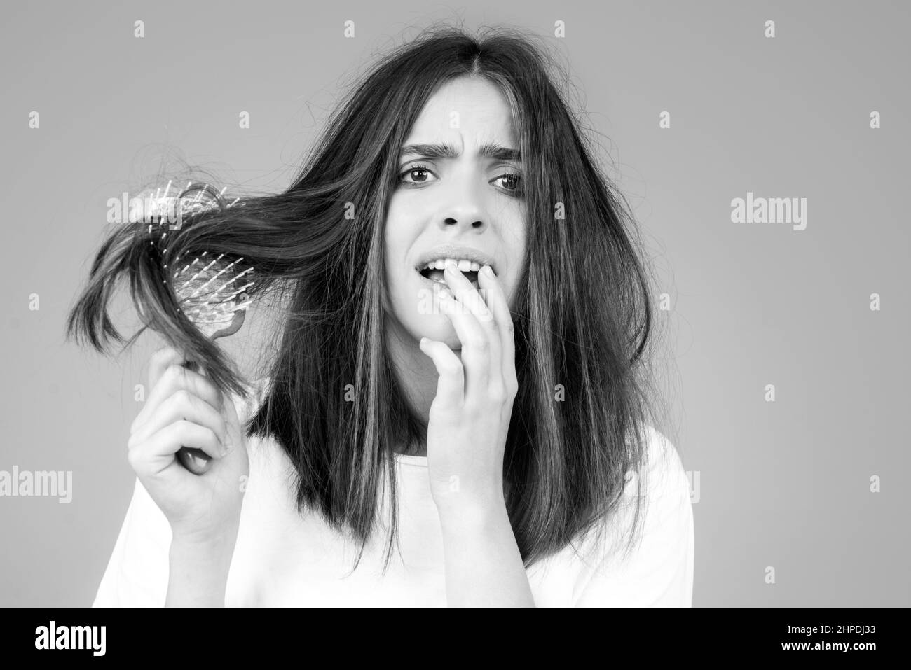 Hair for hair loss problem, woman show her hair tangled damaged hair