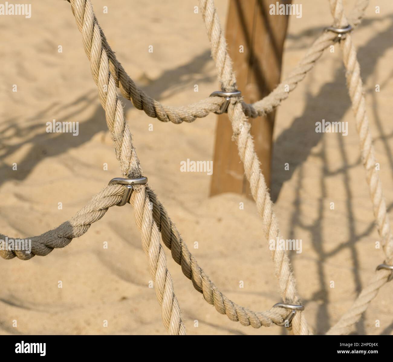 Rope climbing net at playground. Adventure rope park. Modern kids