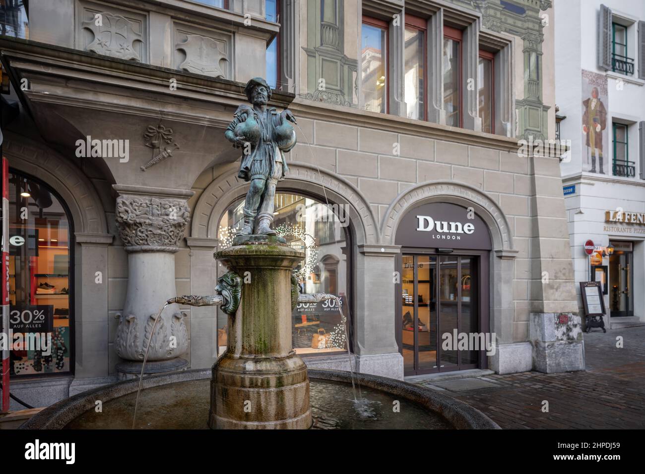 Goose Man Fountain (Gansemannchenbrunnen) at Hirschenplatz - copy of Nuremberg fountain made by Pankraz Labenwolf in 1550 - Lucerne, Switzerland Stock Photo