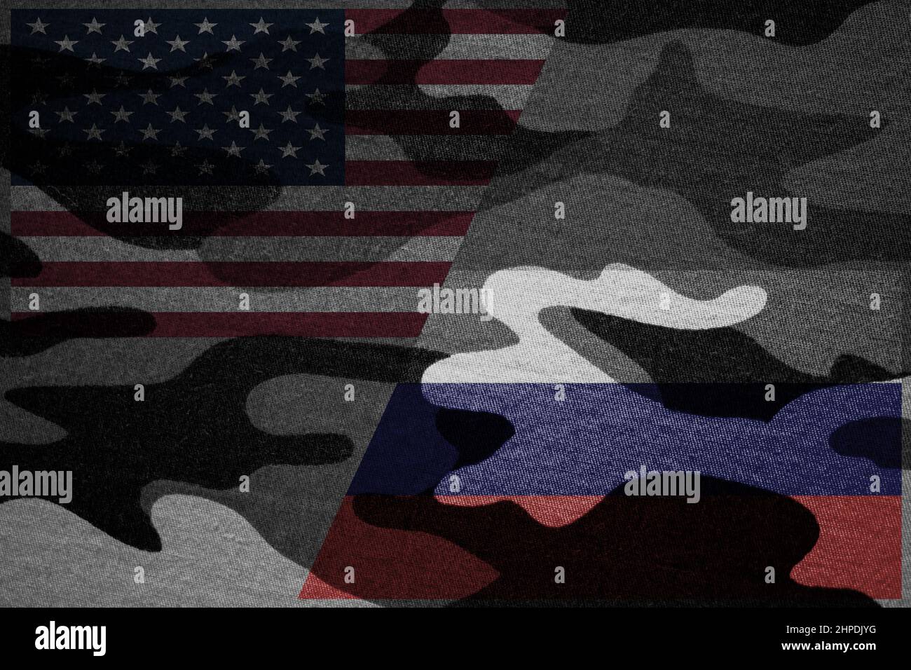 American flag opposite Russian flag on military camouflage background. War between United States of America and Russia concept Stock Photo