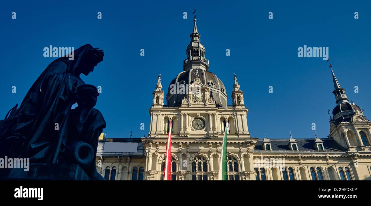 City Hall in Graz with statue on the main square during the day with blue sky Stock Photo