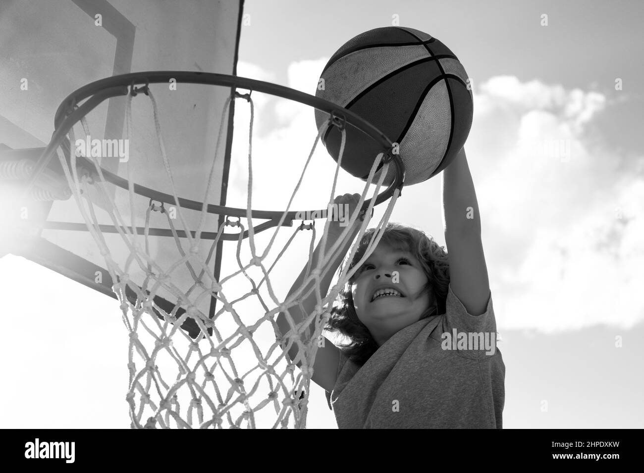 Kids playing basketball. Child sport activity. Healthy children
