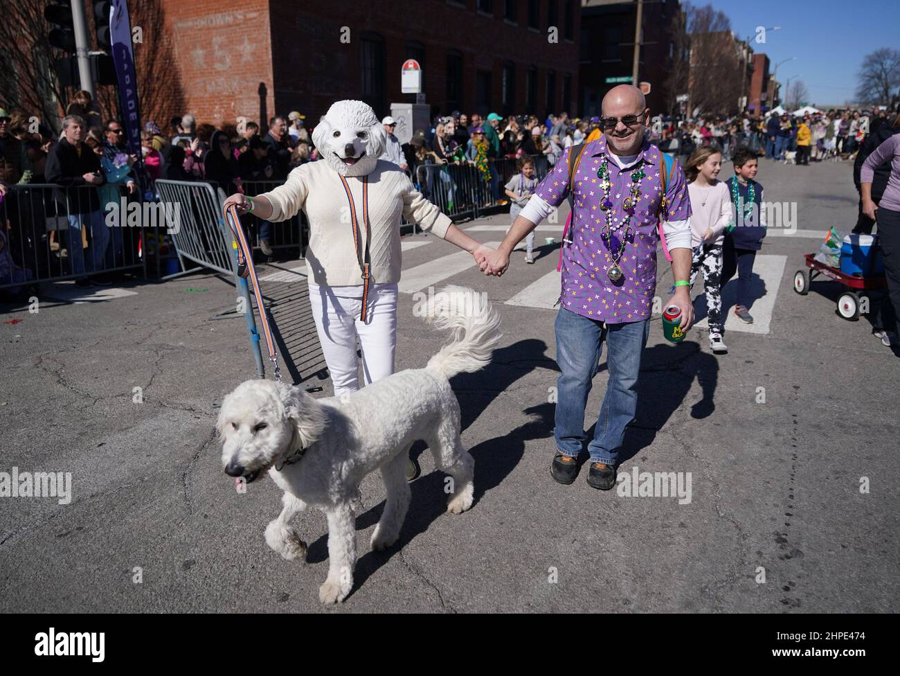 St. Louis, United States. 20th Feb, 2025. A woman wears a dog mask as