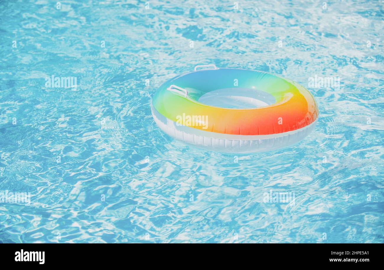 Water background. Pool float, ring floating in a refreshing blue