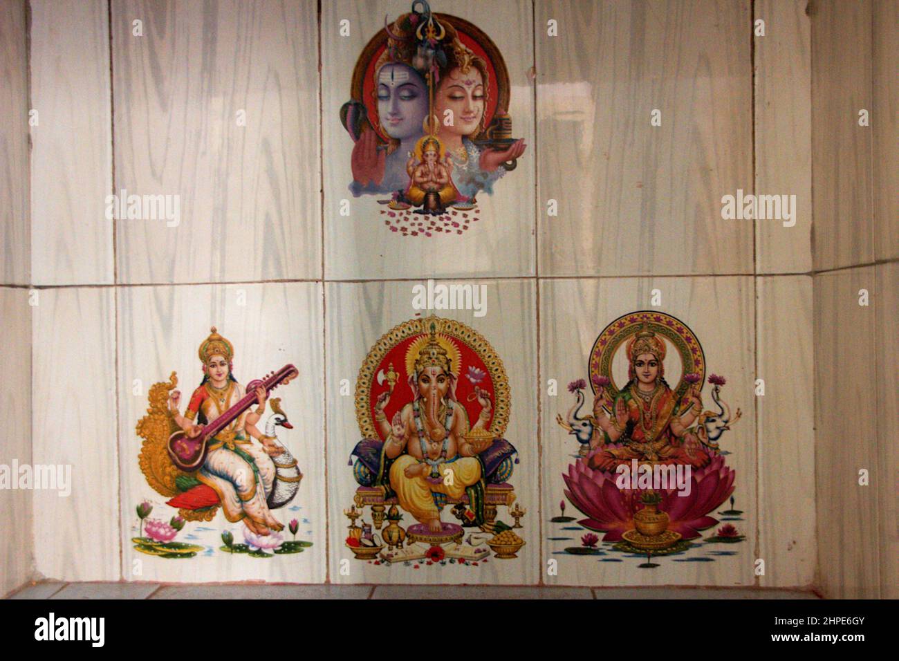 Colour pictures of Shiva, Parvati, Mahasaraswati, and Lakshmi printed on ceramic tiles Stock Photo