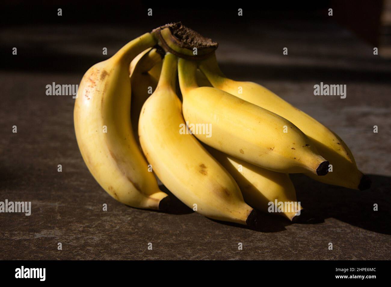 Cluster of ripe yellow fruits hi-res stock photography and images - Alamy